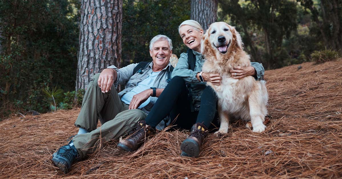 couple hiking with dog